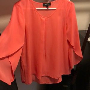 Coral colored blouse